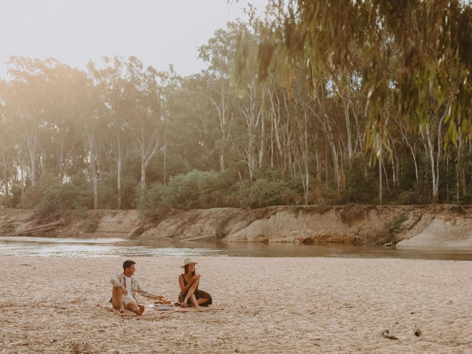 Couple enjoying a picnic at Thompson's Beach