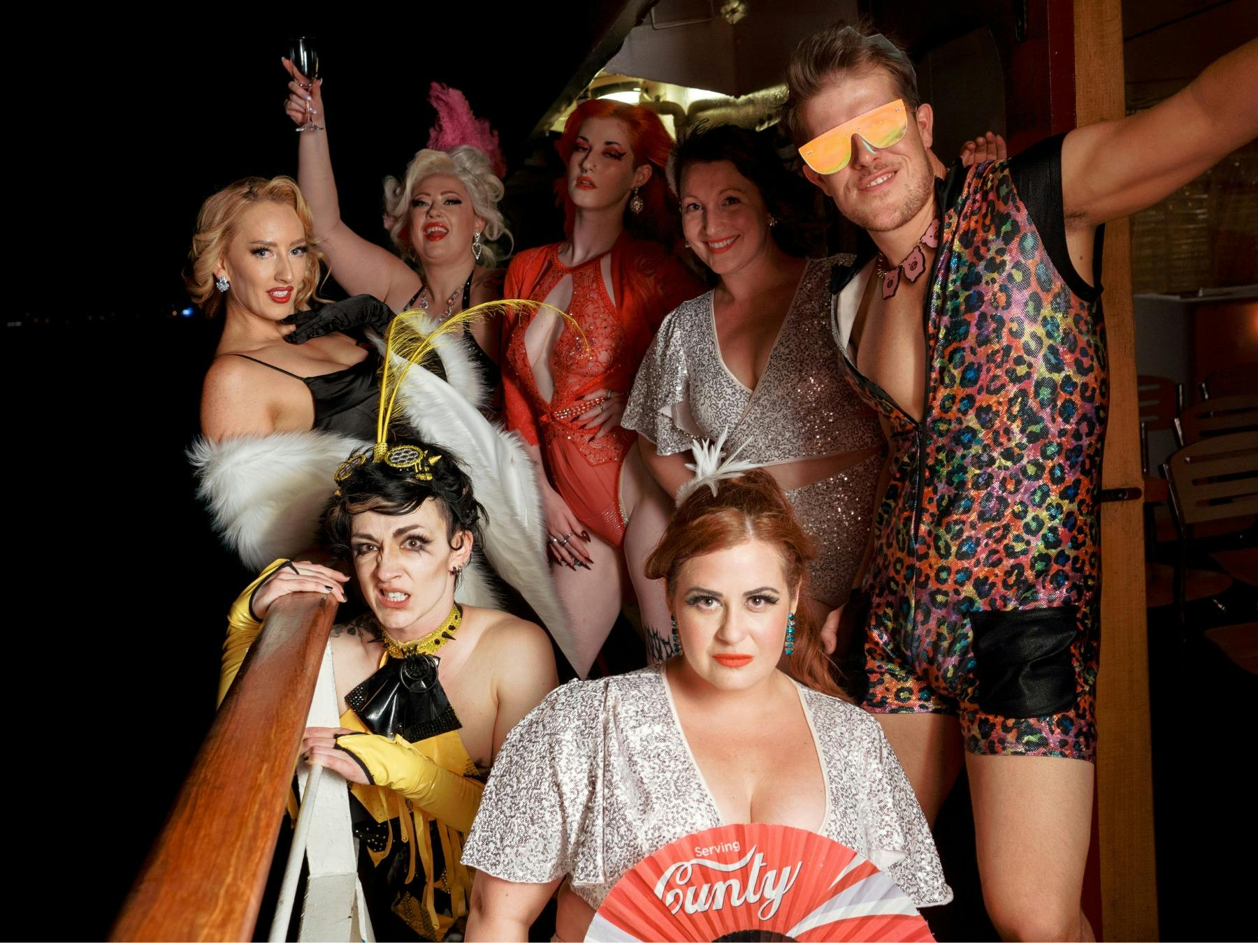 Seven performers on the Lady Cutler Melbourne Showboat at night.