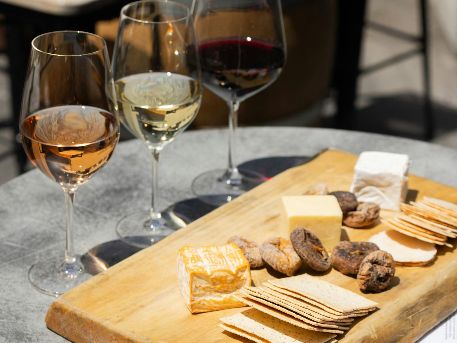 Cheese board with 3 glasses of wine