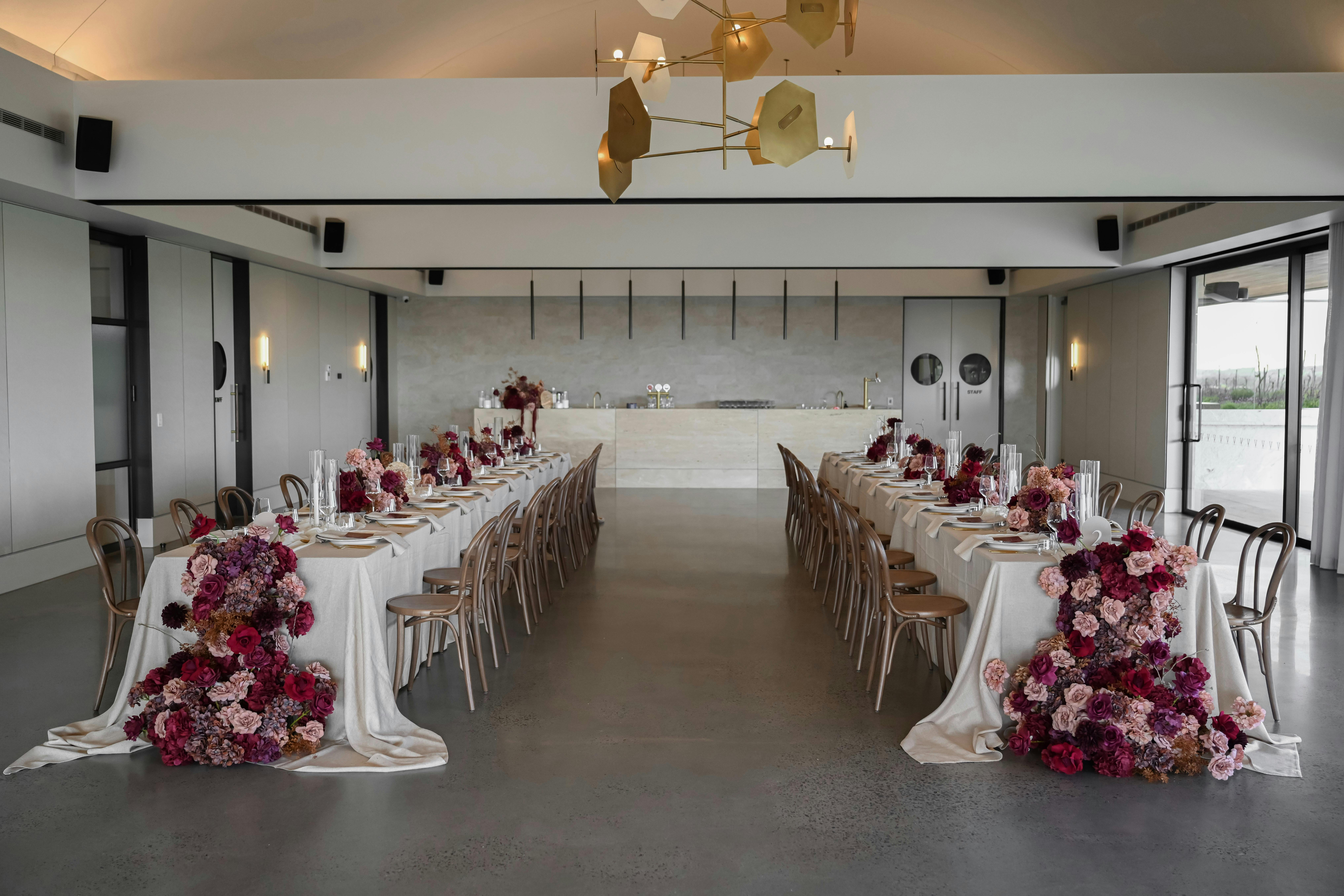 The Terrace event space set up  with long tables for a wedding