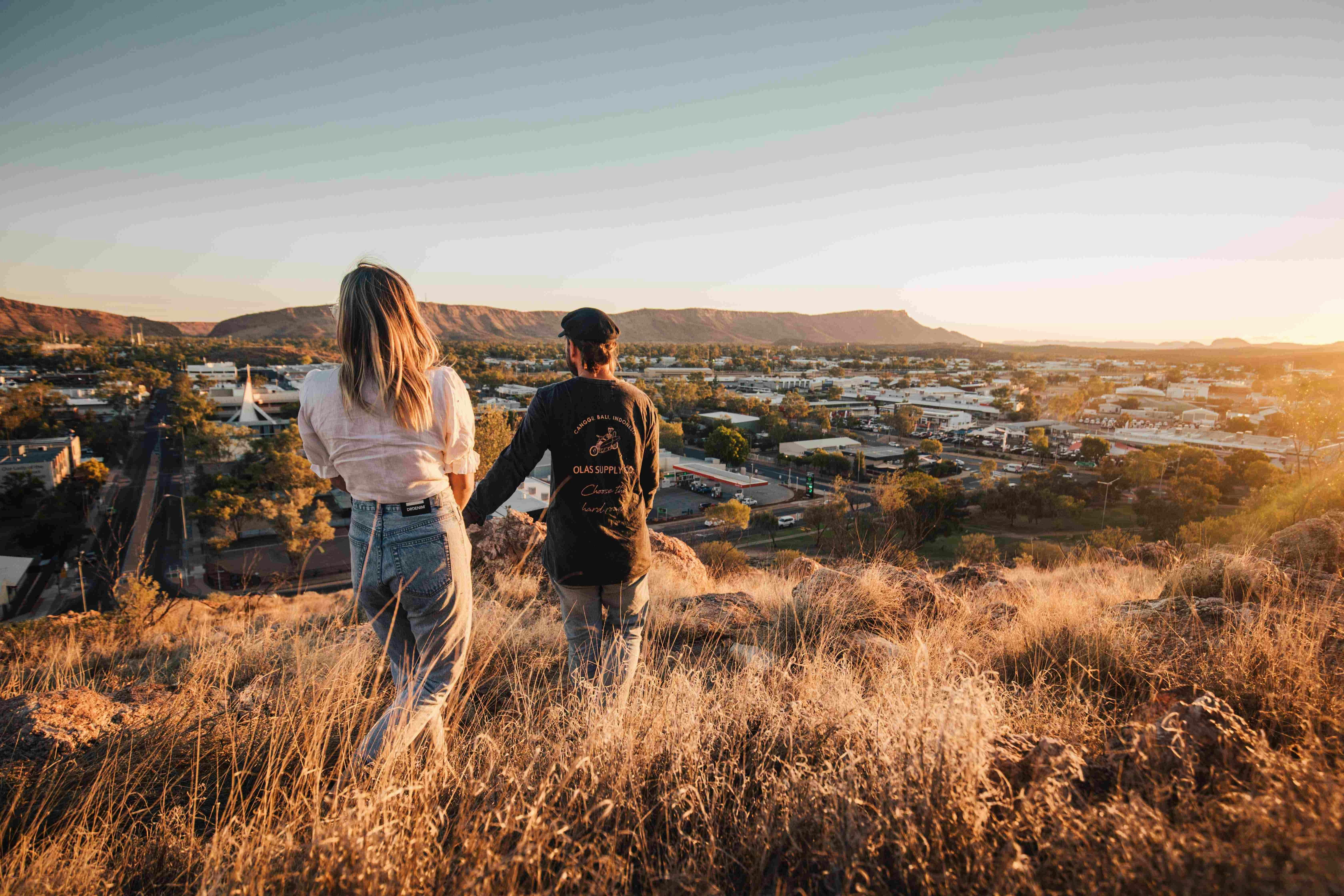 Couple walking down Anzac hill in Alice Springs