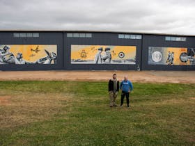Artist Sam Brooks and his assistant Mark Harding with the completed mural.