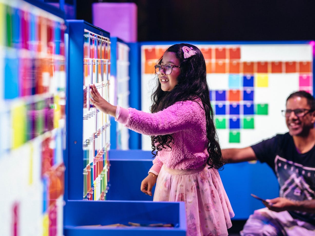 Child enjoying the Illuminate exhibition