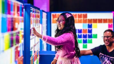 Child enjoying the Illuminate exhibition