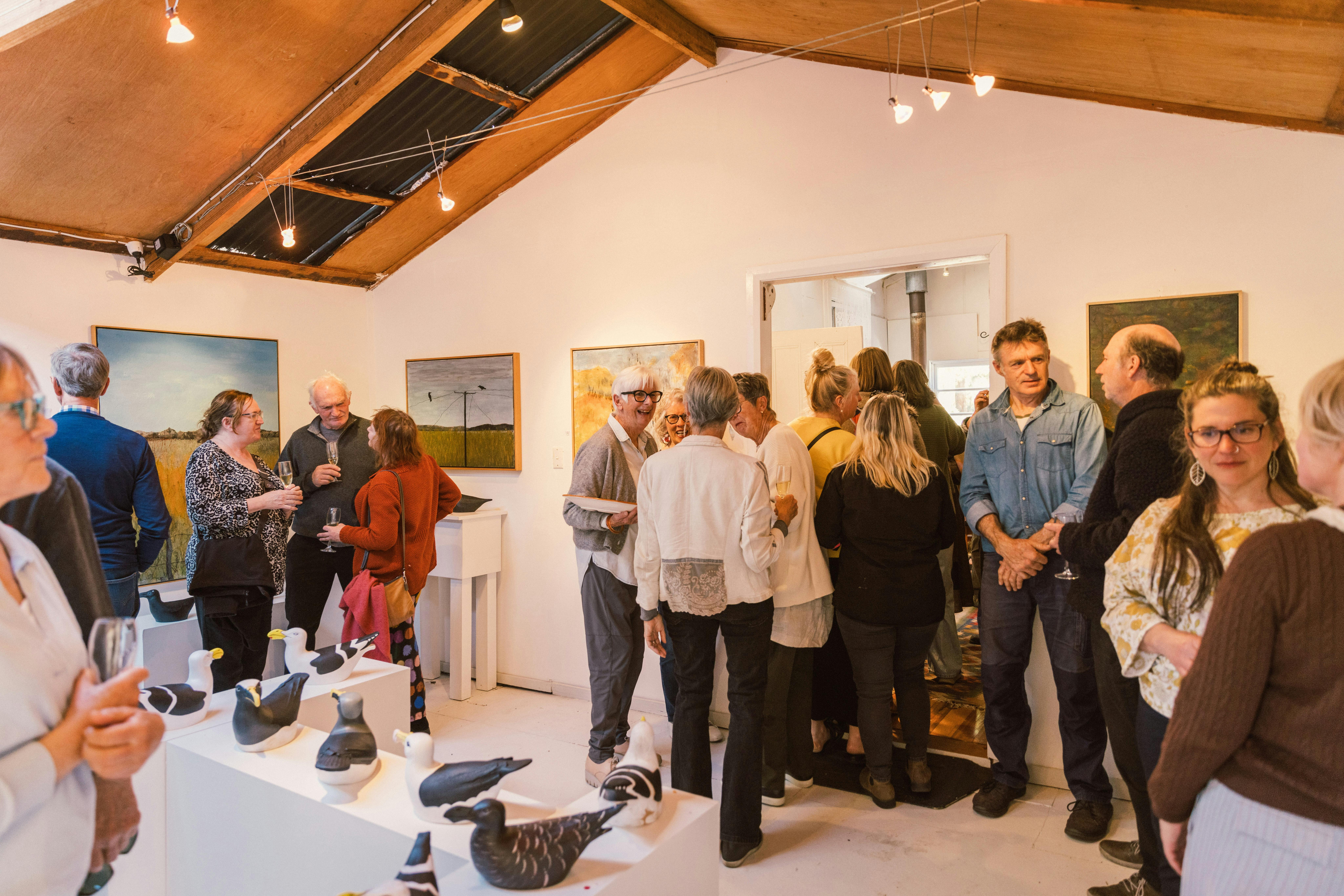 Interior Artless Gallery with members of the public.