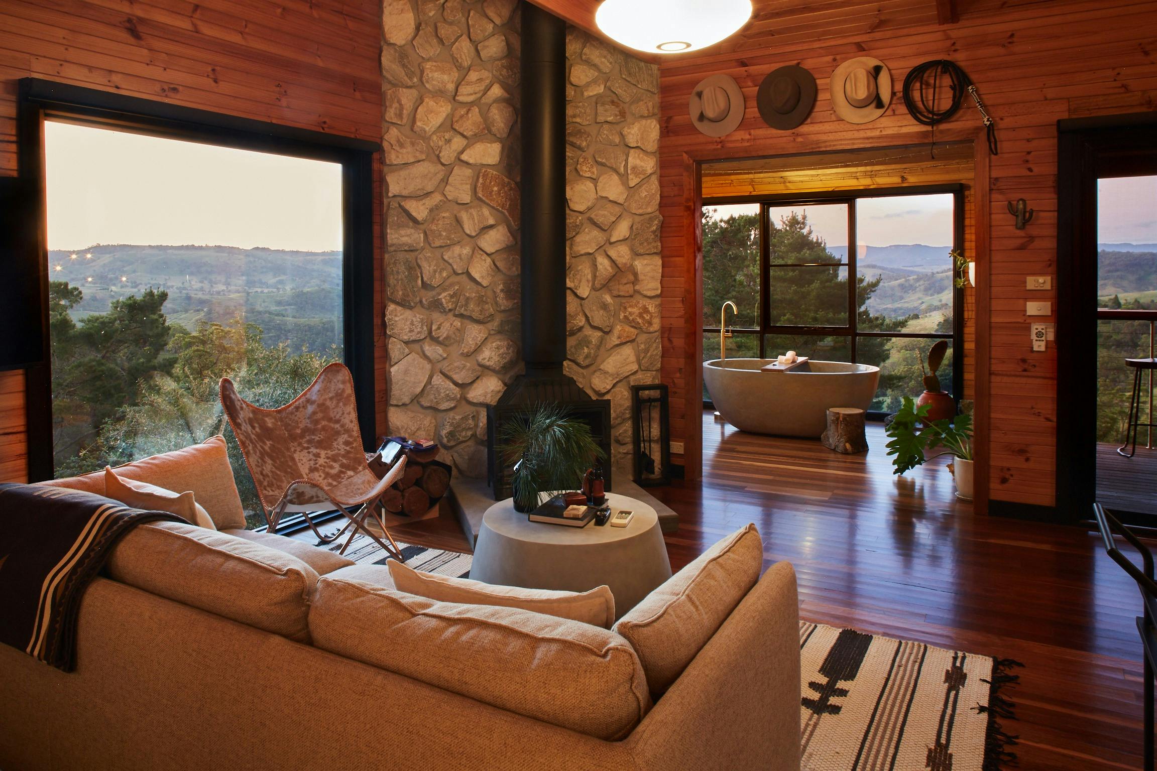 Living area at Woodlands Cabin with indoor wood burning fireplace