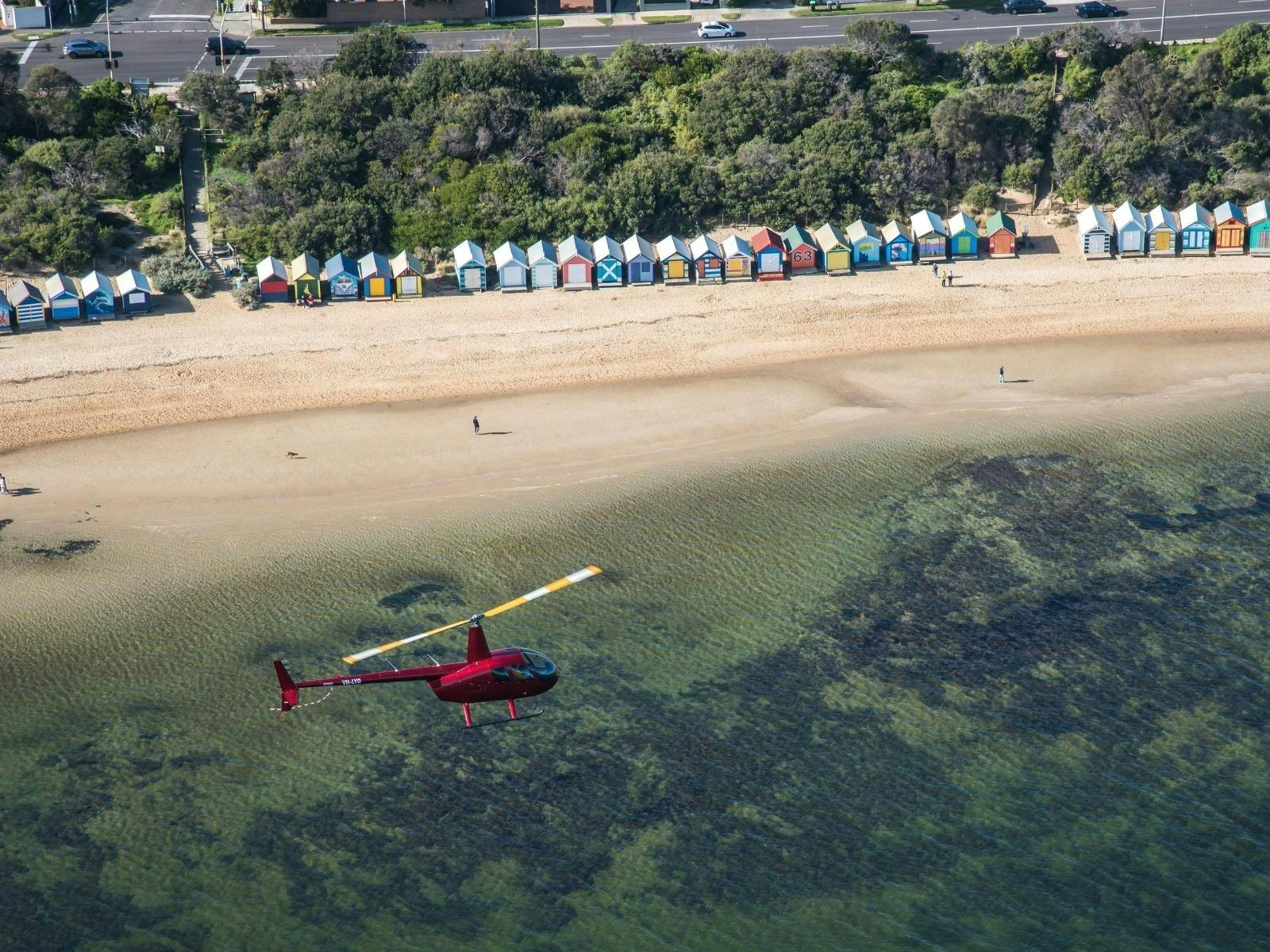 Helicopter flying over Brighton Beach Boxes