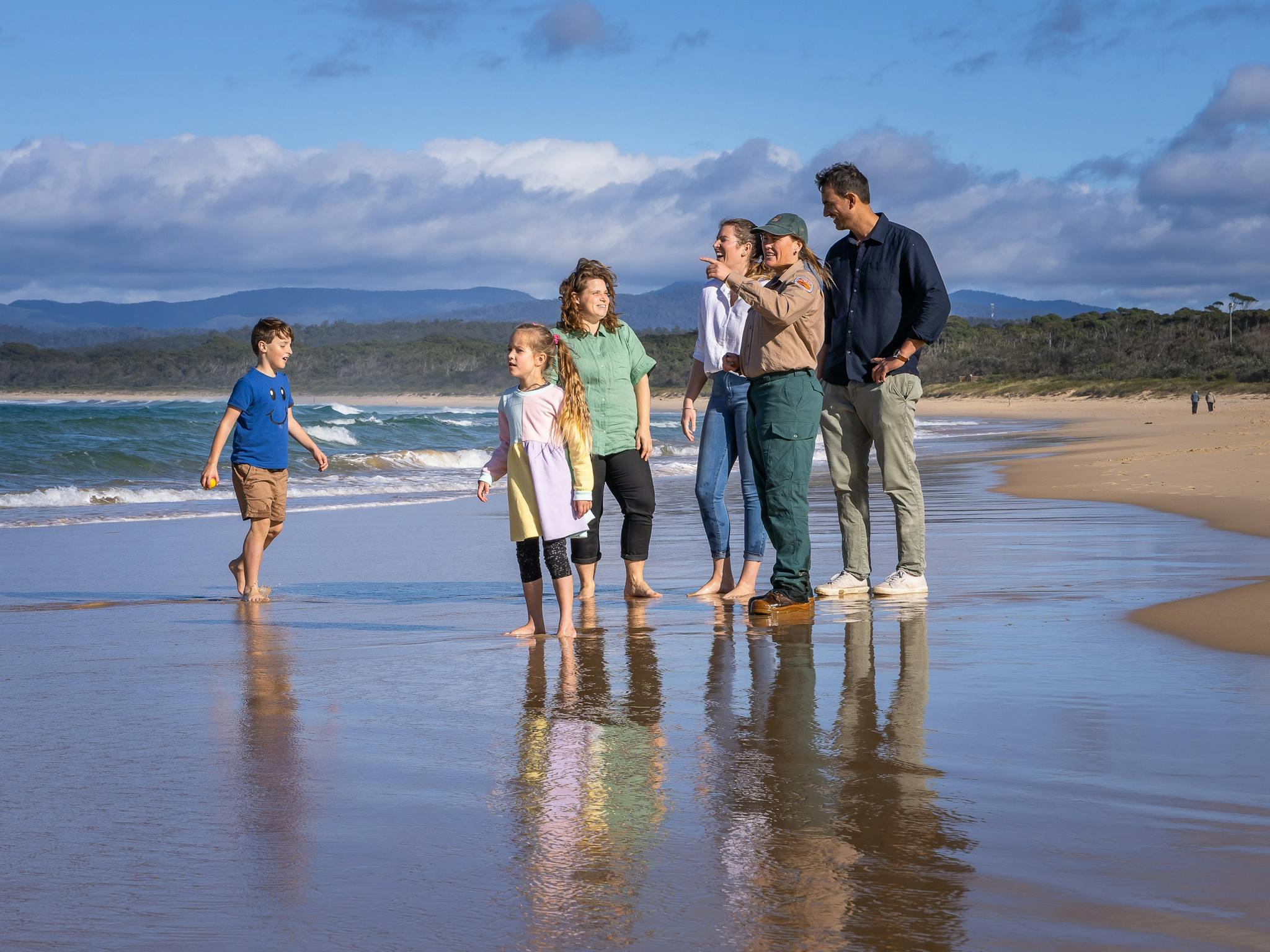 guide with group on beach.