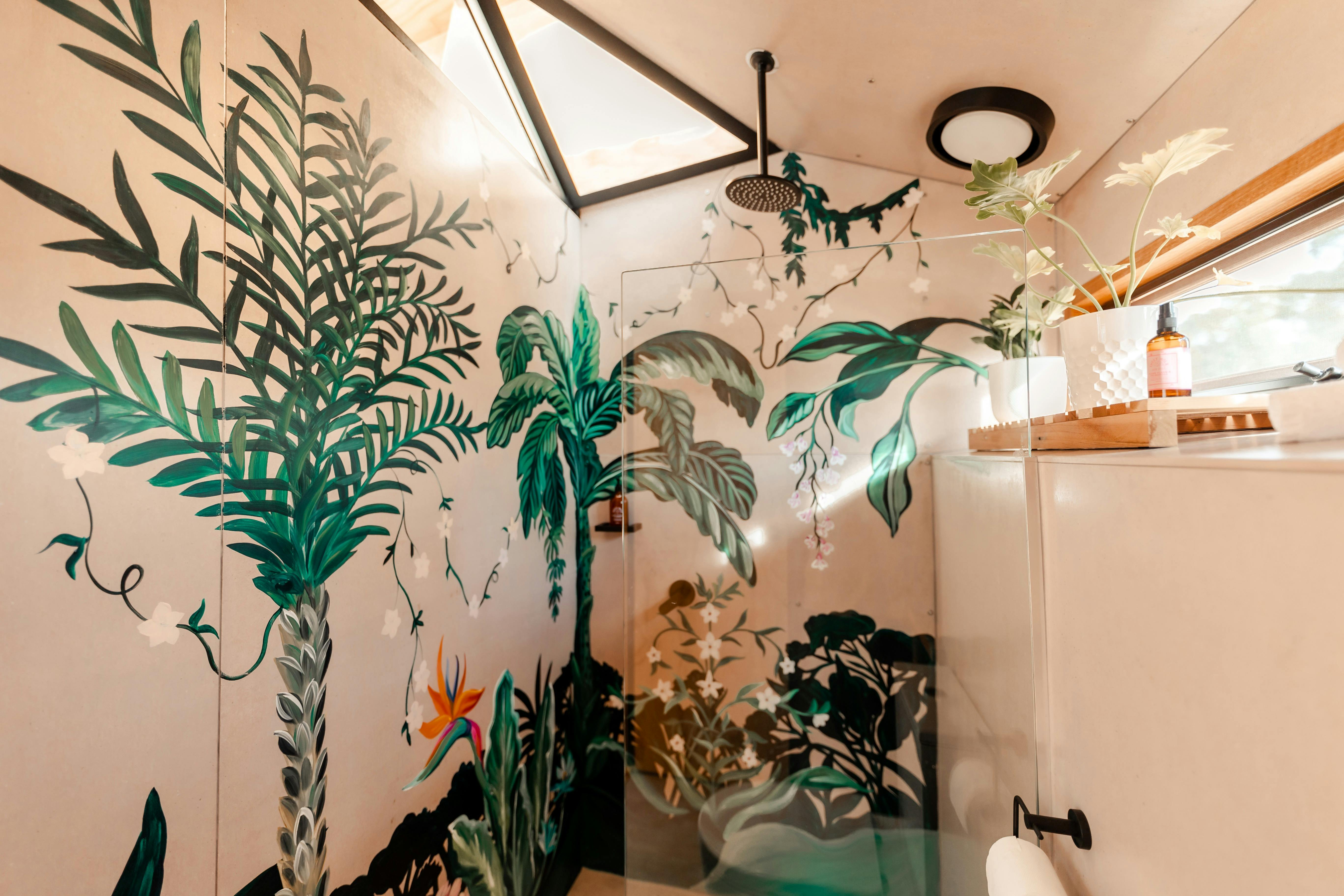 Gorgeous bathroom with hand painted mural from local artists