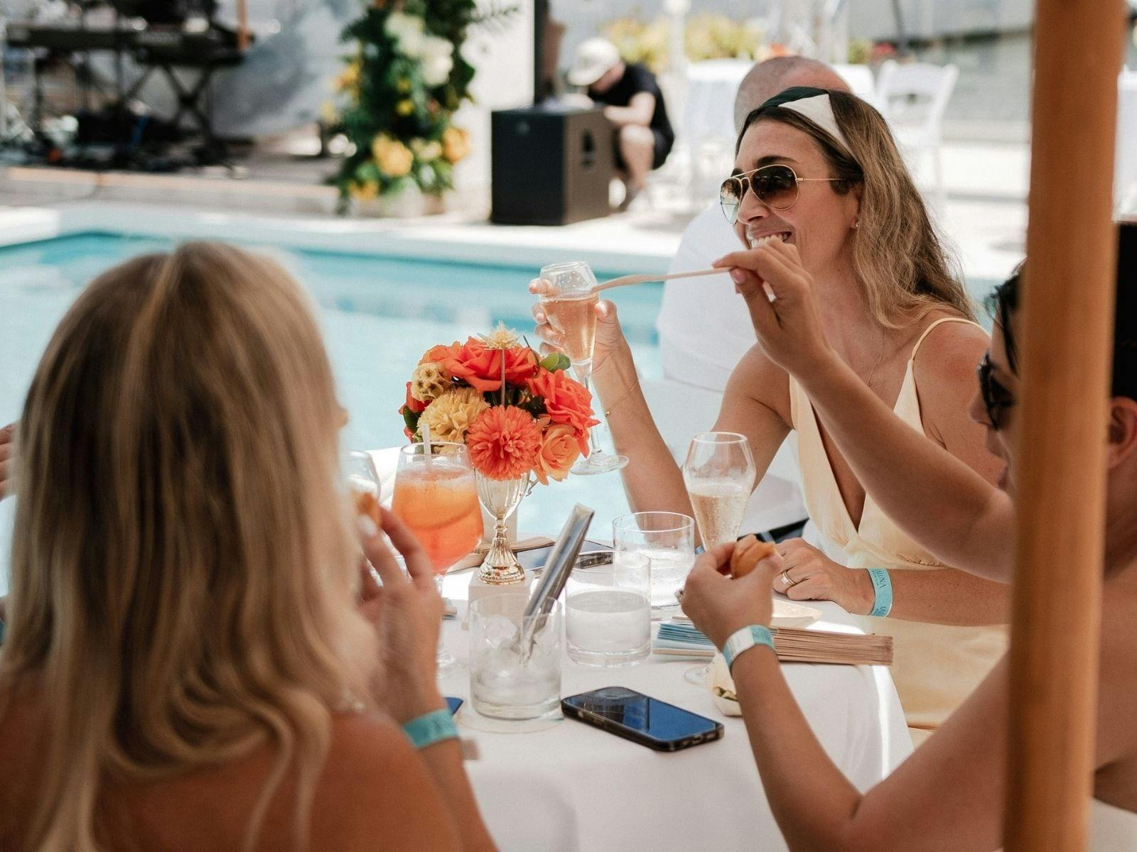 Some ladies enjoyinf an aperol spritz at La Luna Beach Club on the Gold Coast