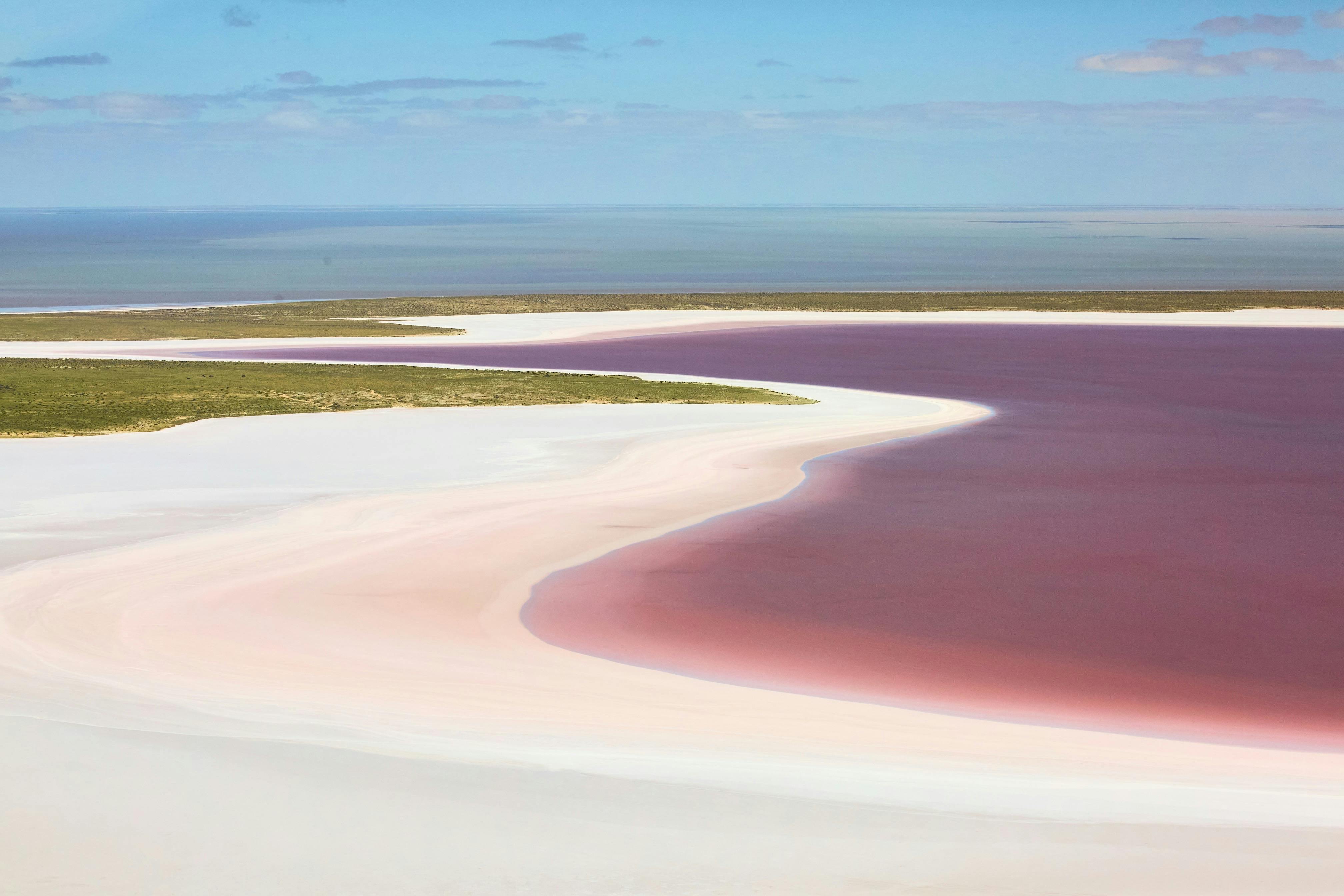 Aerial view of pink saltwater and white sandbanks at Kati Thandau2013Lake Eyre, South Australia.