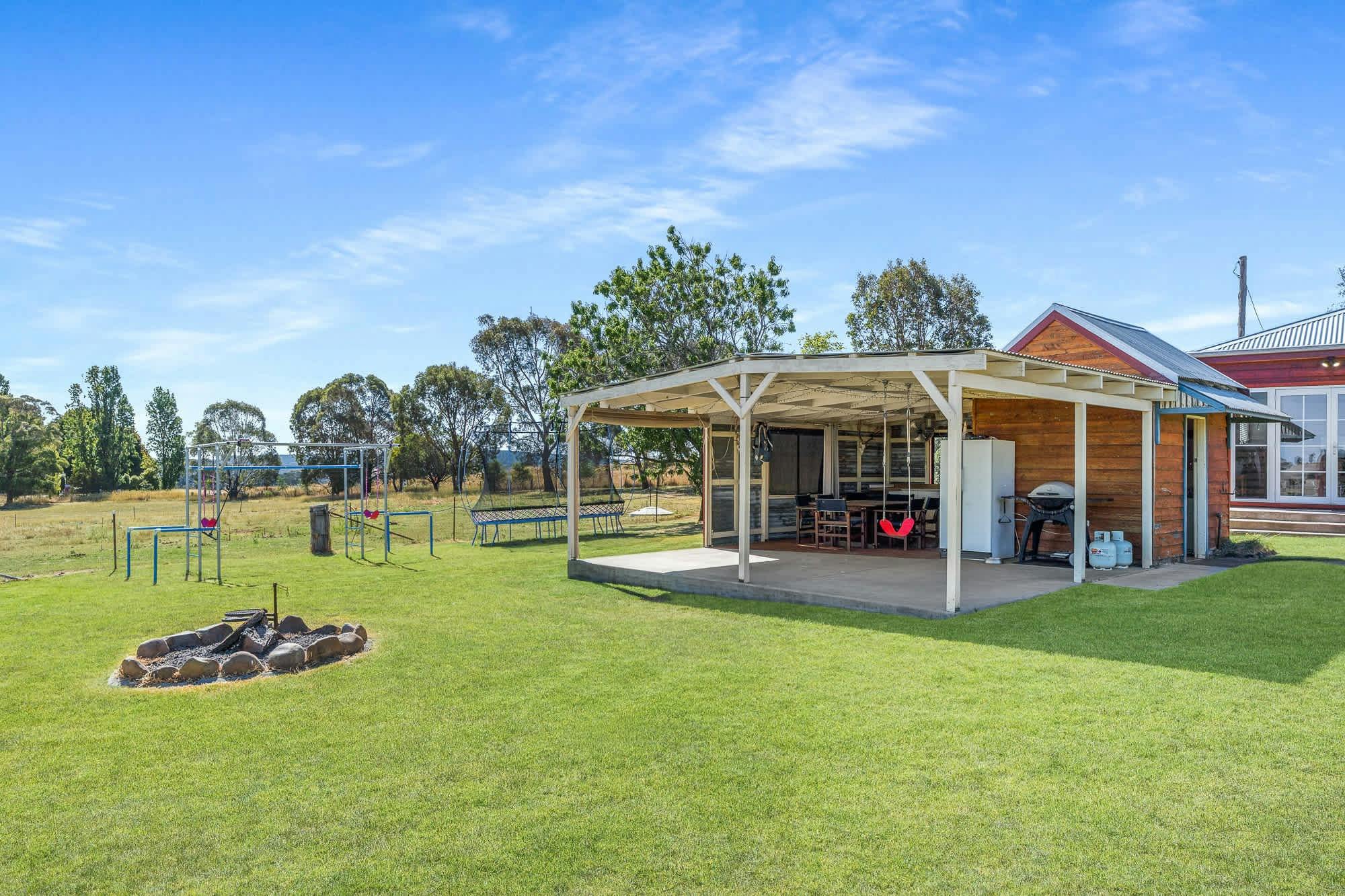 Back verandah with concrete, fire pit