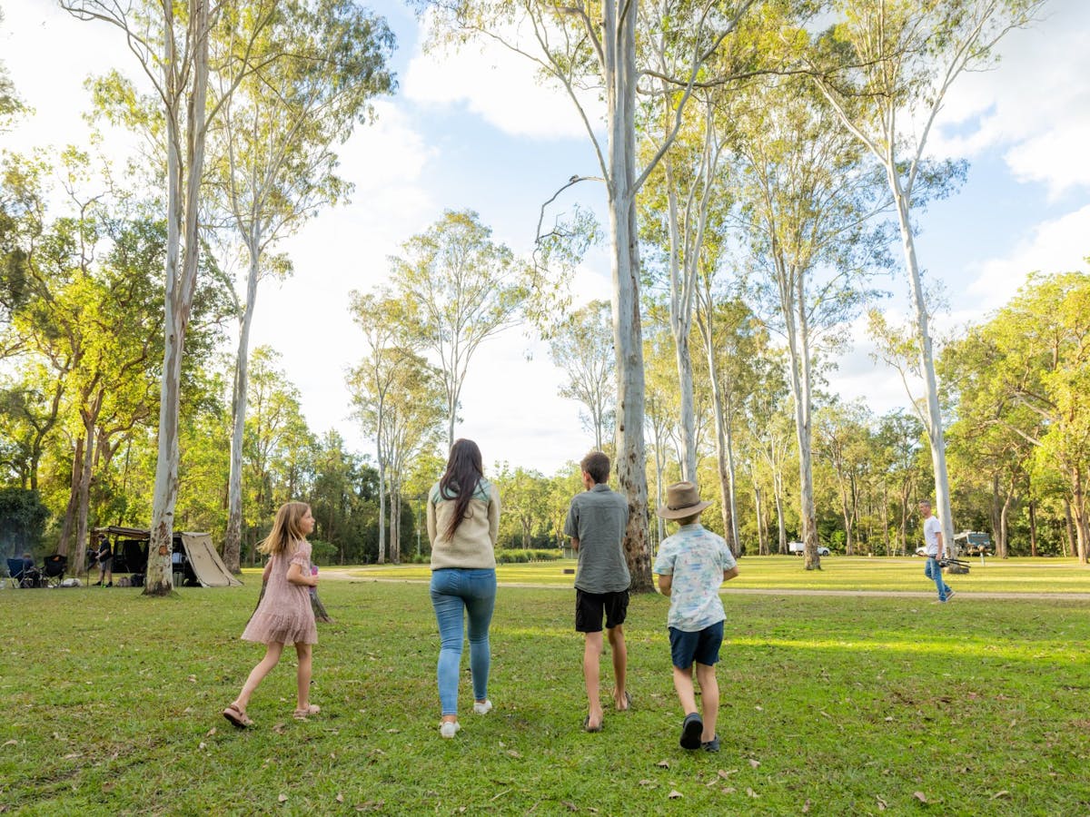 A family walking around the campground area