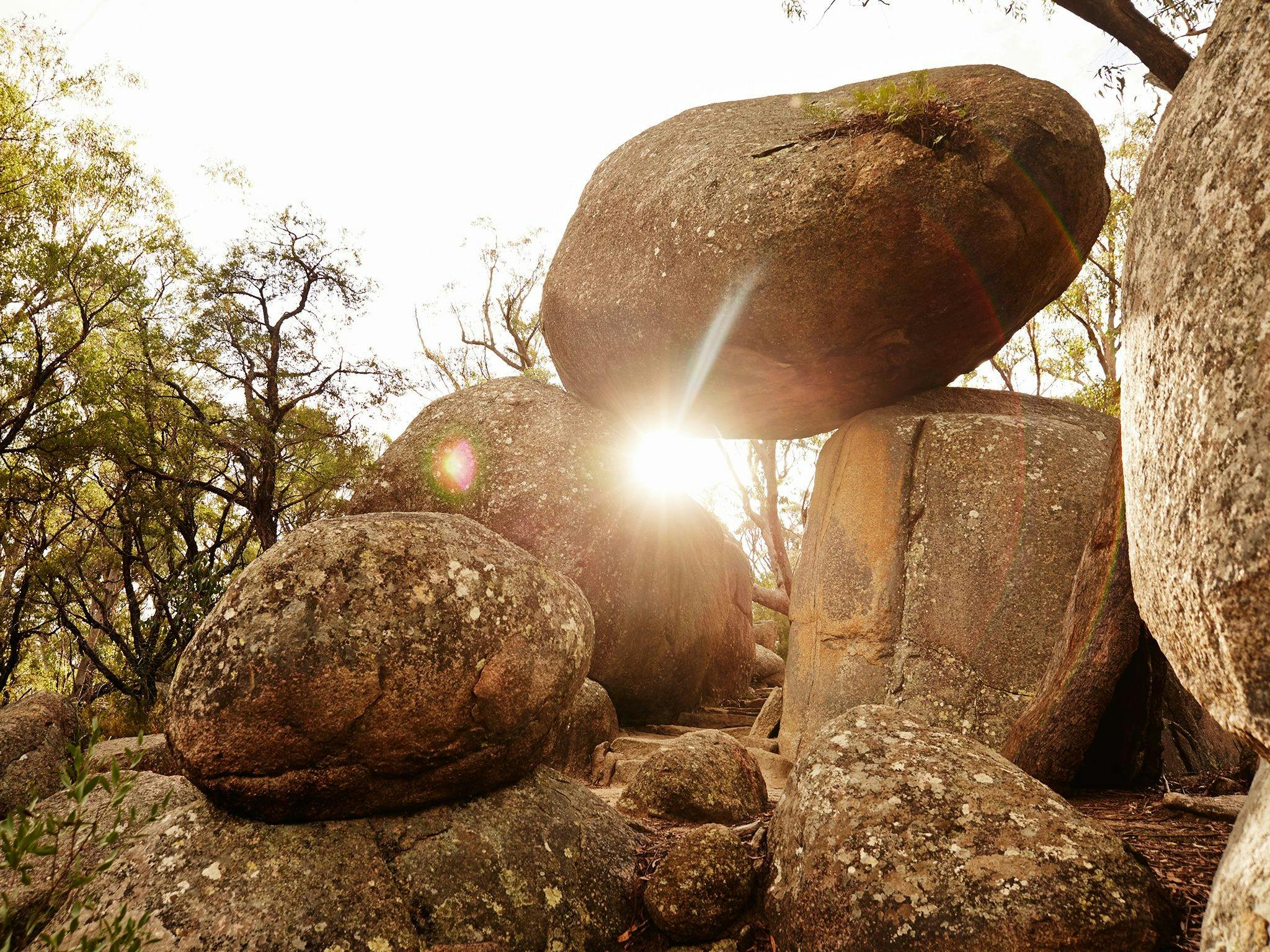 An impressive granite rock formation gives the impression of a balancing rock. An impressive granite rock formation gives the impression of a balancing rock.