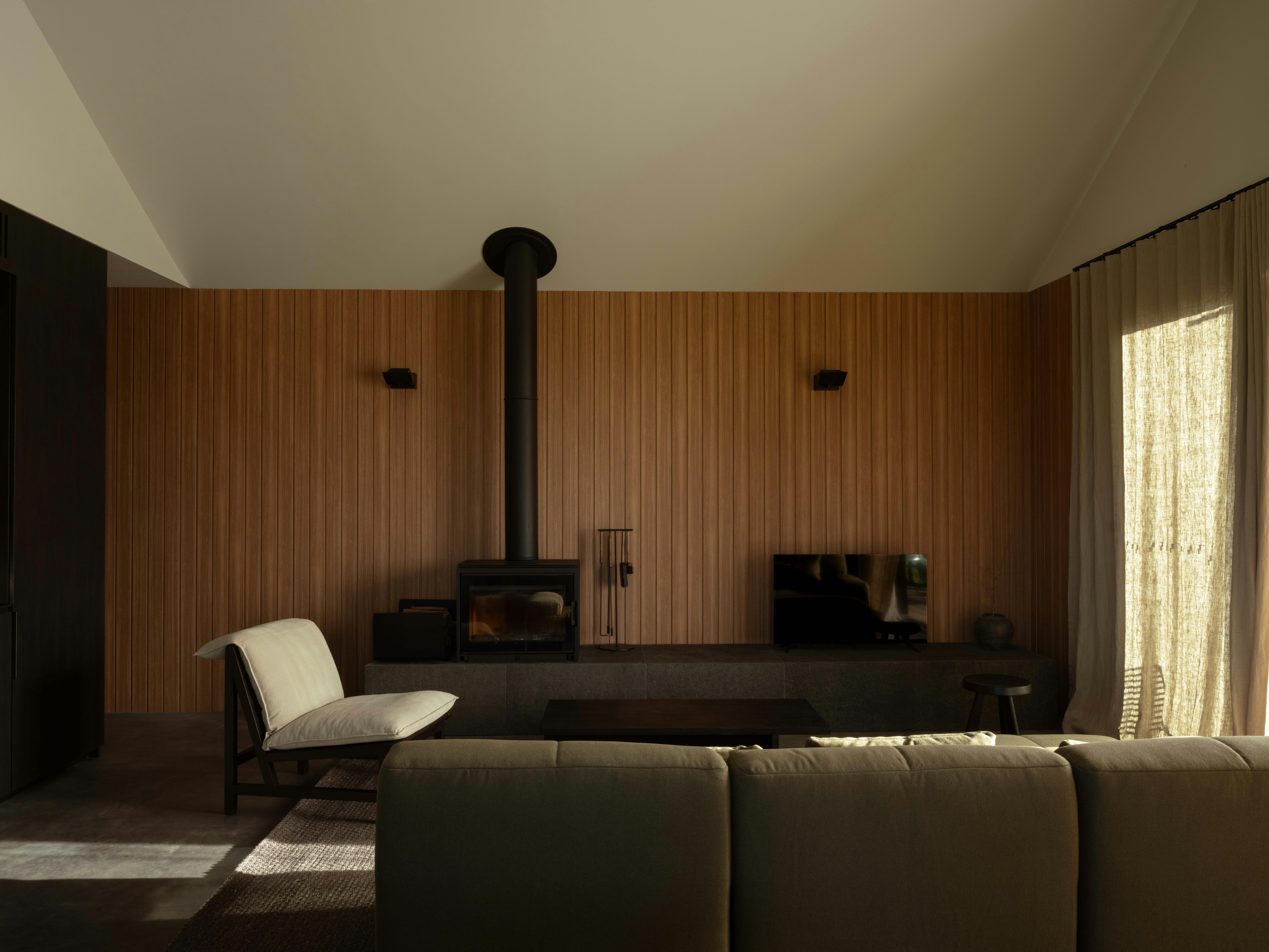Warm living room with fireplace and tv