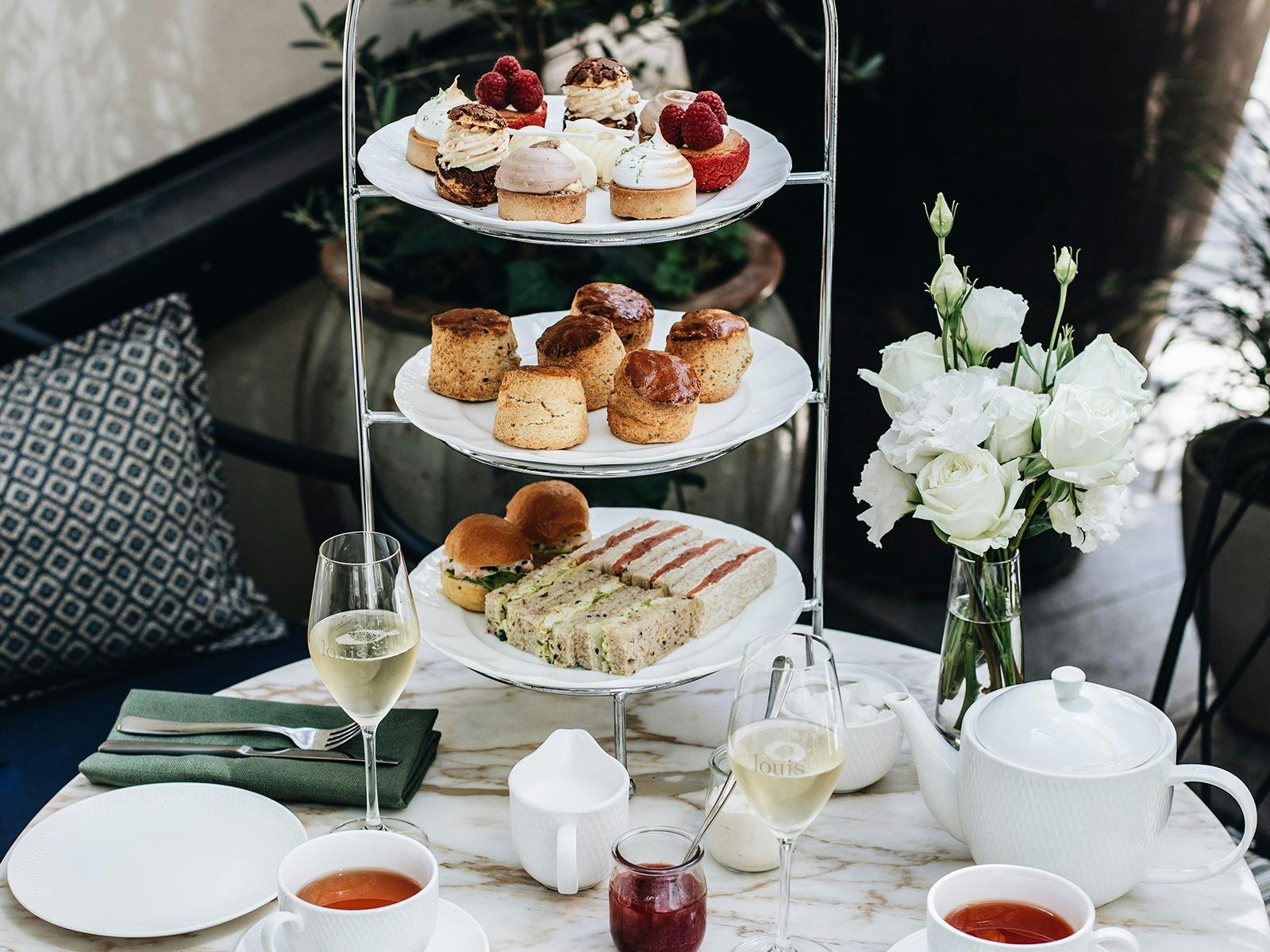 Close-up of high tea cake stand on table