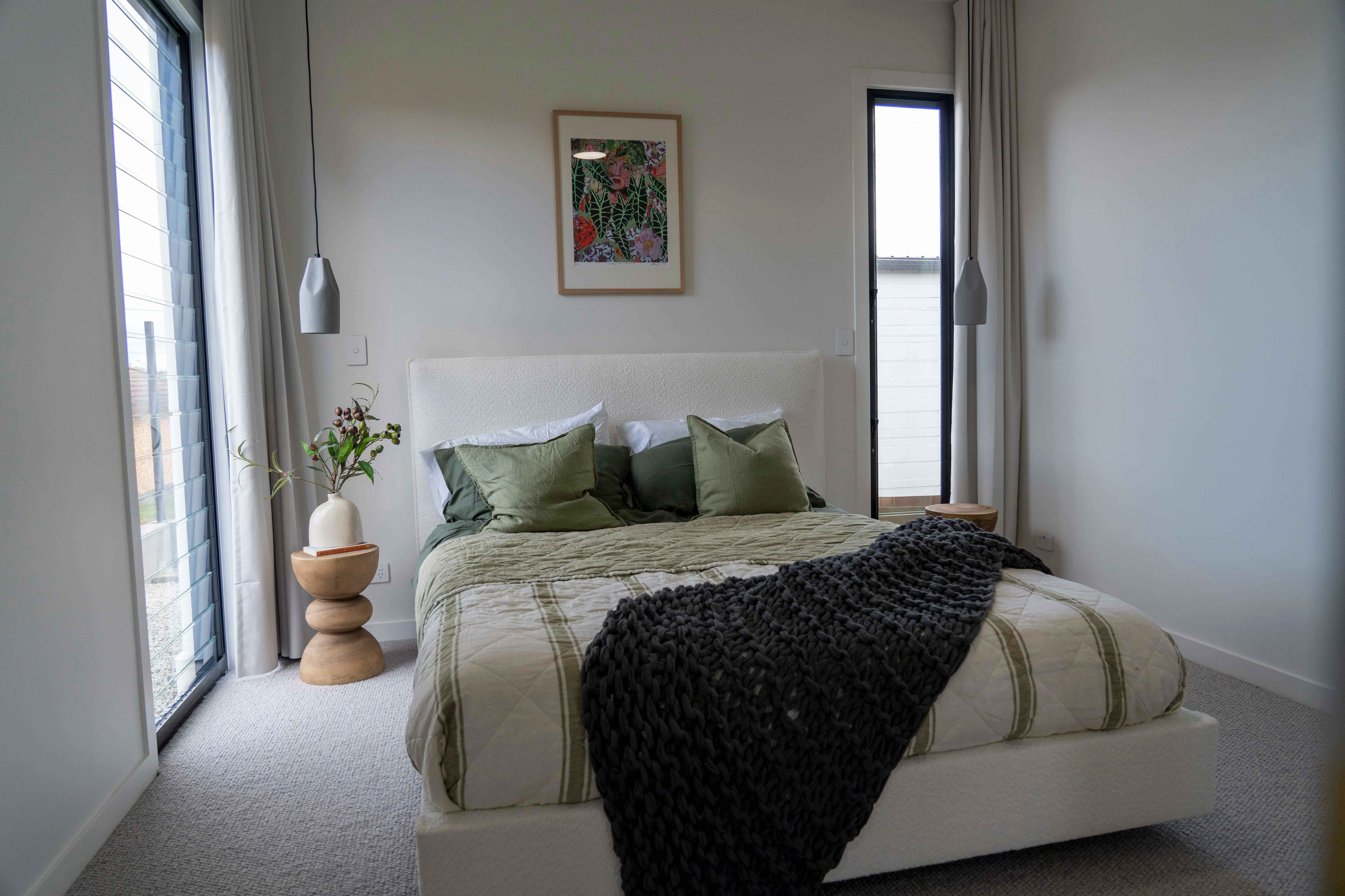 Queen Bedroom with French Flax Linen Quit, concrete bedside lights and goose down doonas.