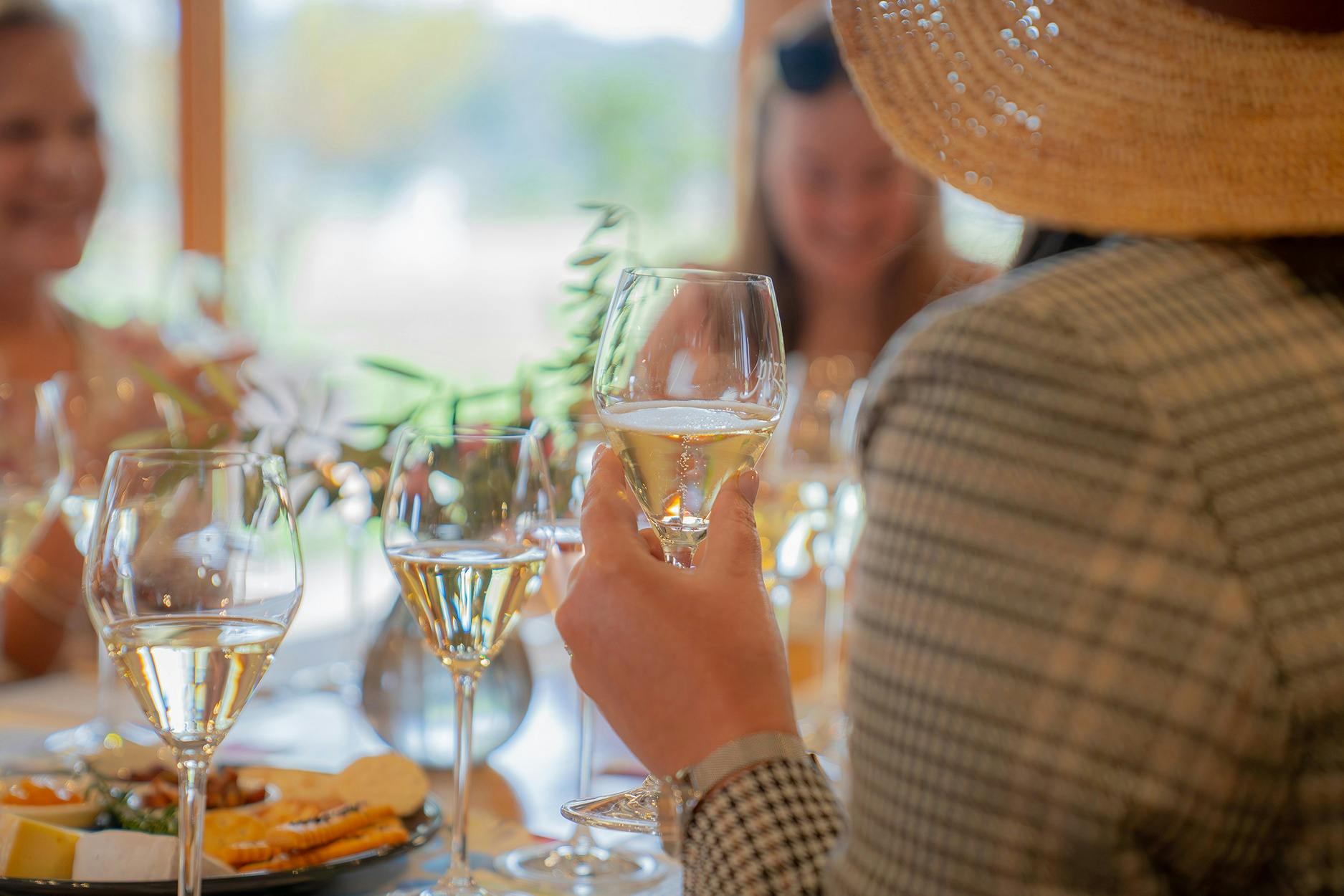 Woman enjoing Pizzini Sparling Italians high tea experience