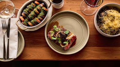 Carrots + Carrot Top Chimmichurri, Wagyu Flank, Crispy Sprouts + Mimolette