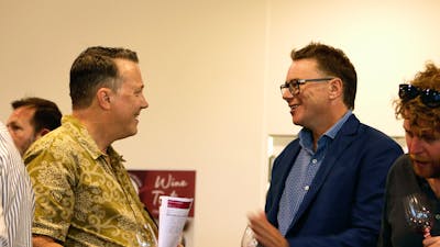 Nick O'Leary talking to a wine taster