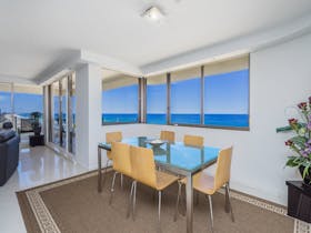 Dining area with beachfront views and patio