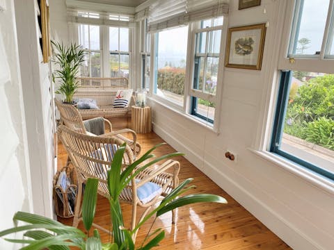 Sun-room with views of Black Beach and the light house