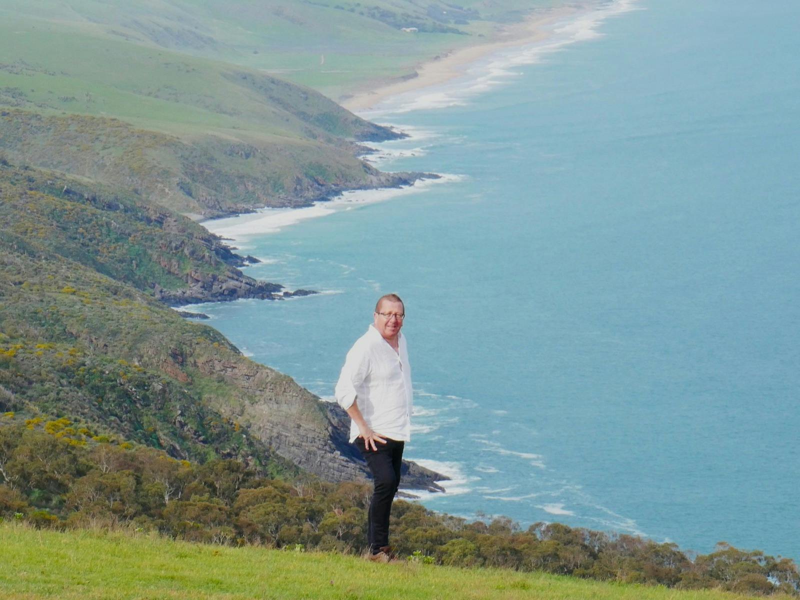 a man looking at the view from Tapanappa Lookout