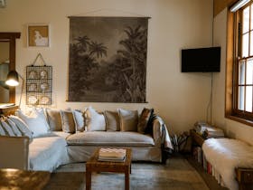 Wifi access, Smart TV, comfortable sofa, reading material, board games, local artwork, wood burner