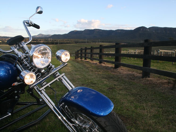 Trike and fence at sunset stop