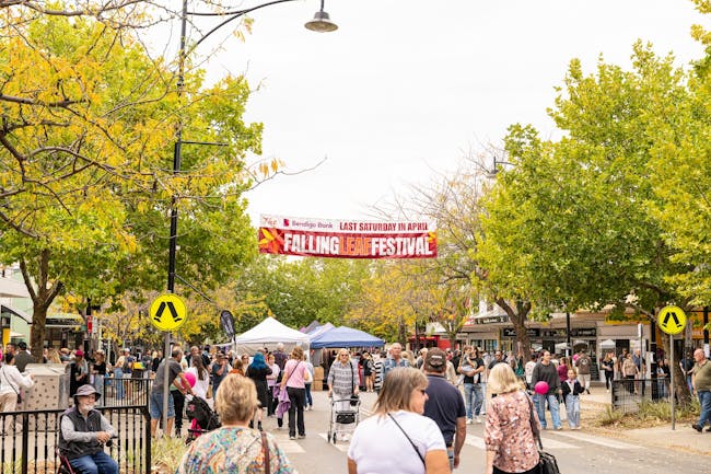 A crowd in the Tumut main street with market stalls
