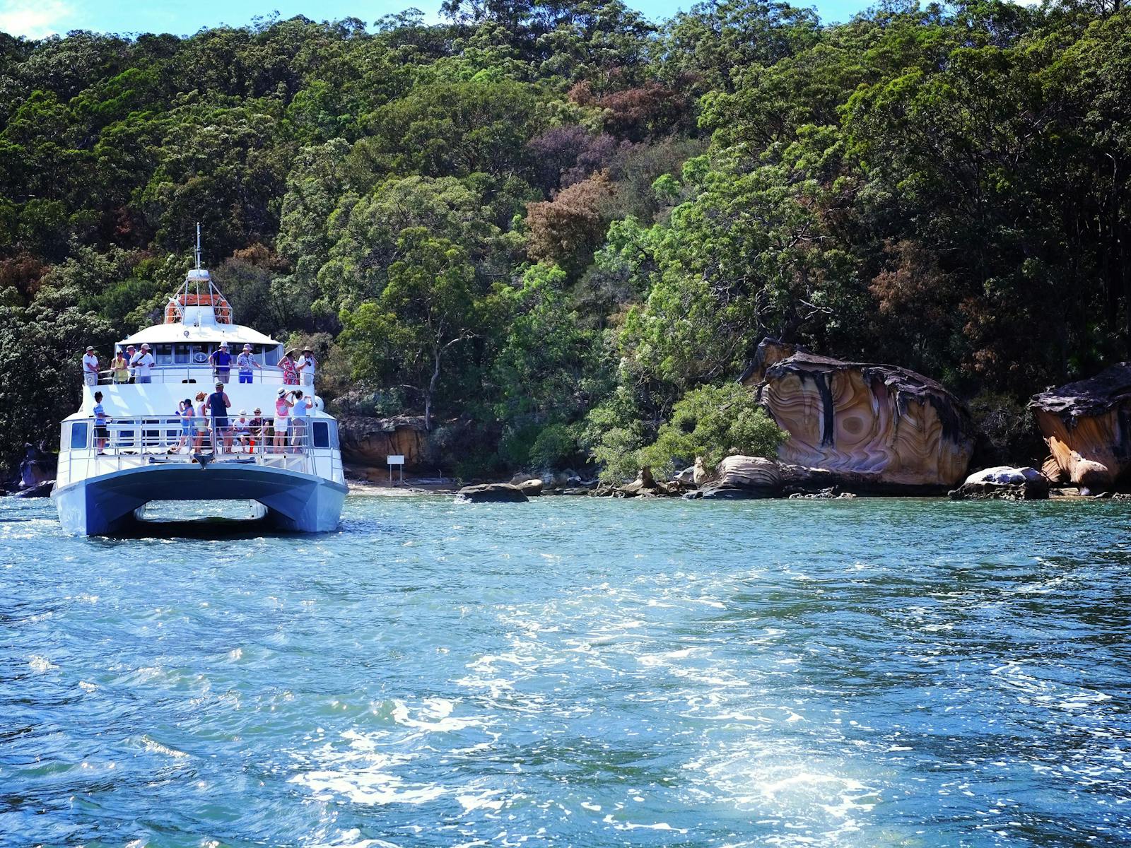 The post boat beside some spectacular Hawkesbury sandstone