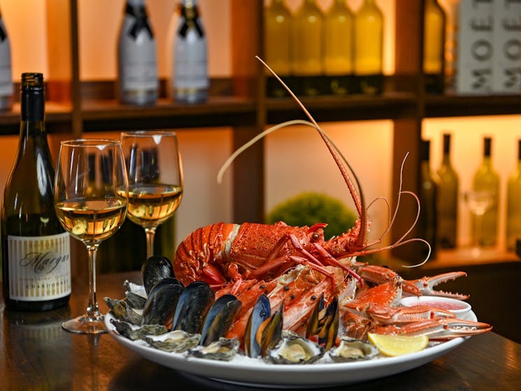 Seafood platter with a bottle of chardonnay inside the private wine room