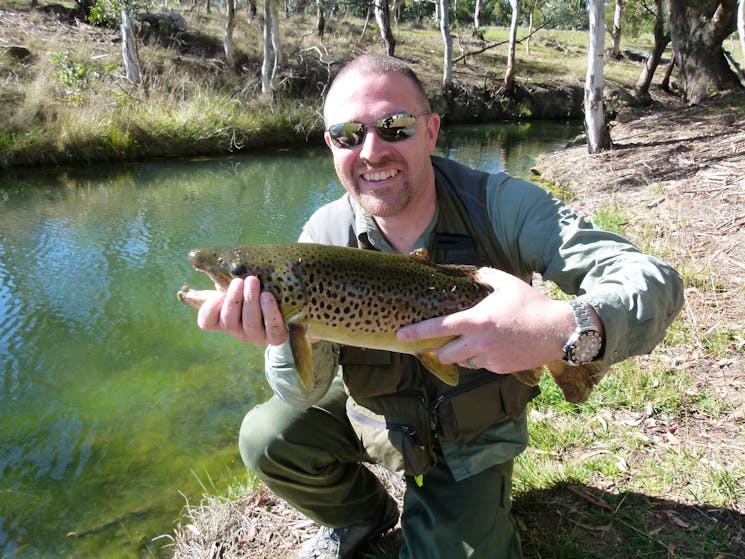 Fisherman holding large fish