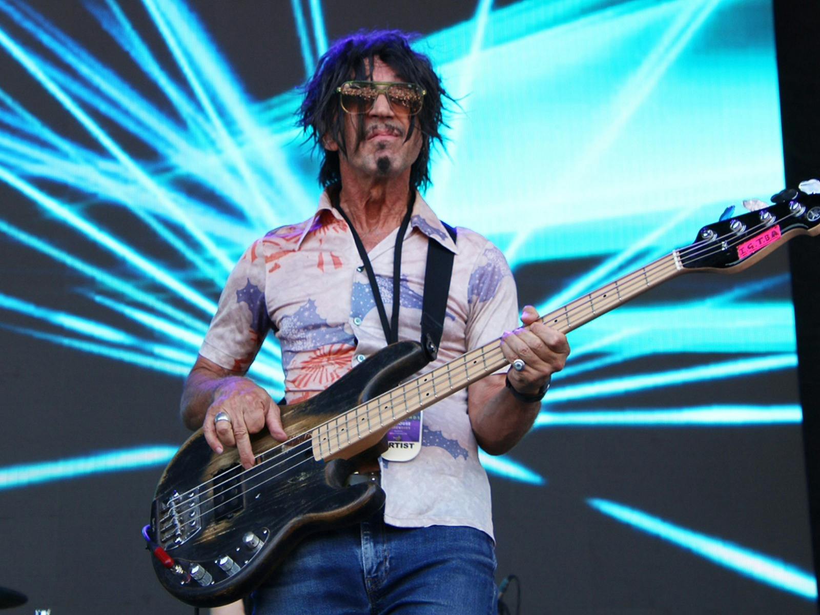man with a guitar on stage