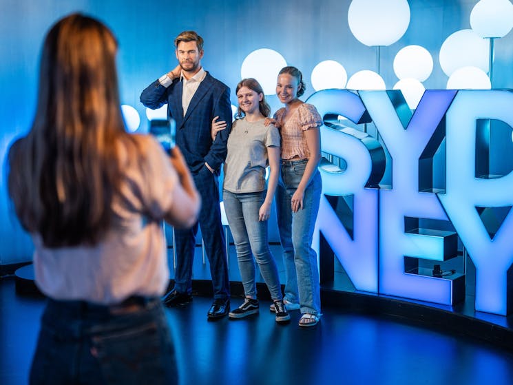 Guests Getting Their Photo Taken With Chris Hemsworth Wax Figure
