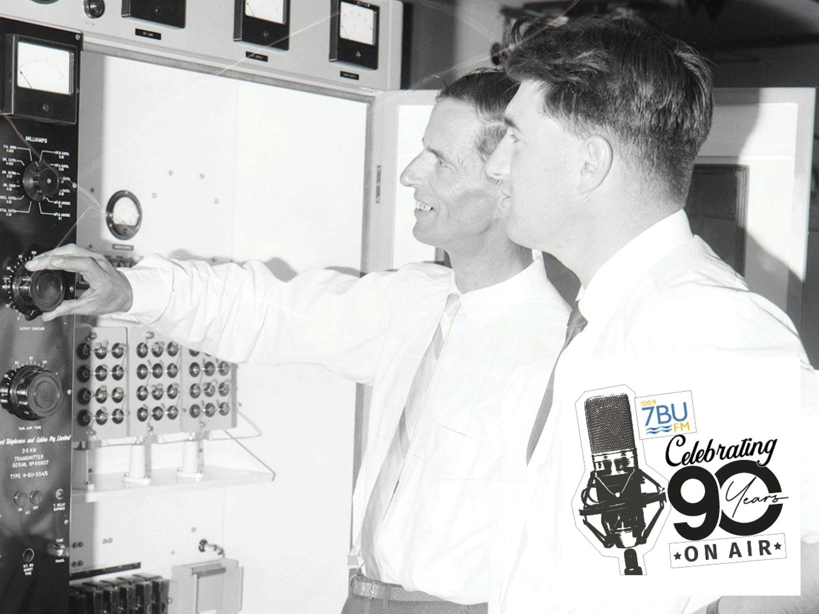 Black and White photo with 2 men at radio control board