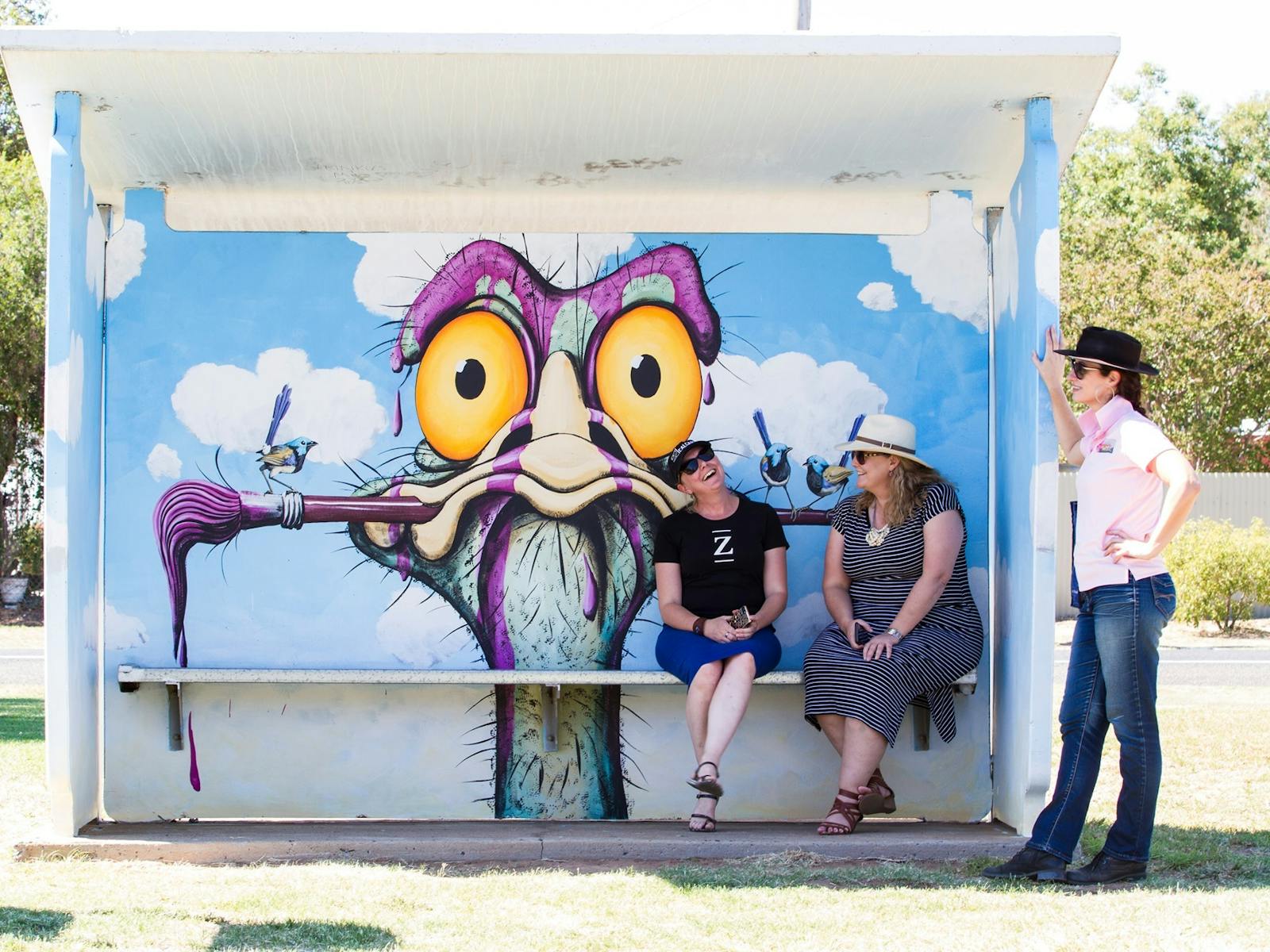 Lightning Ridge artist John Murray's iconic whimsical emu character on a Gular bus stop