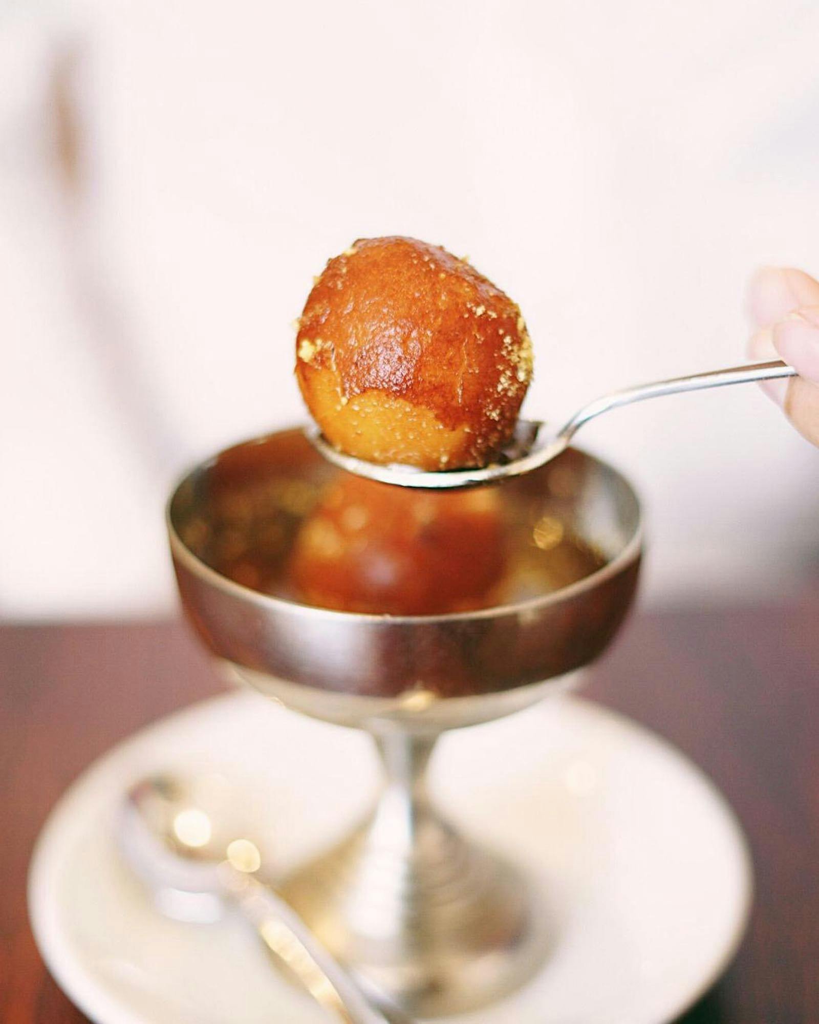 Gulab Jamun, the signature dessert and New India Restaurant, Adelaide.  Balls served in syrup sauce.