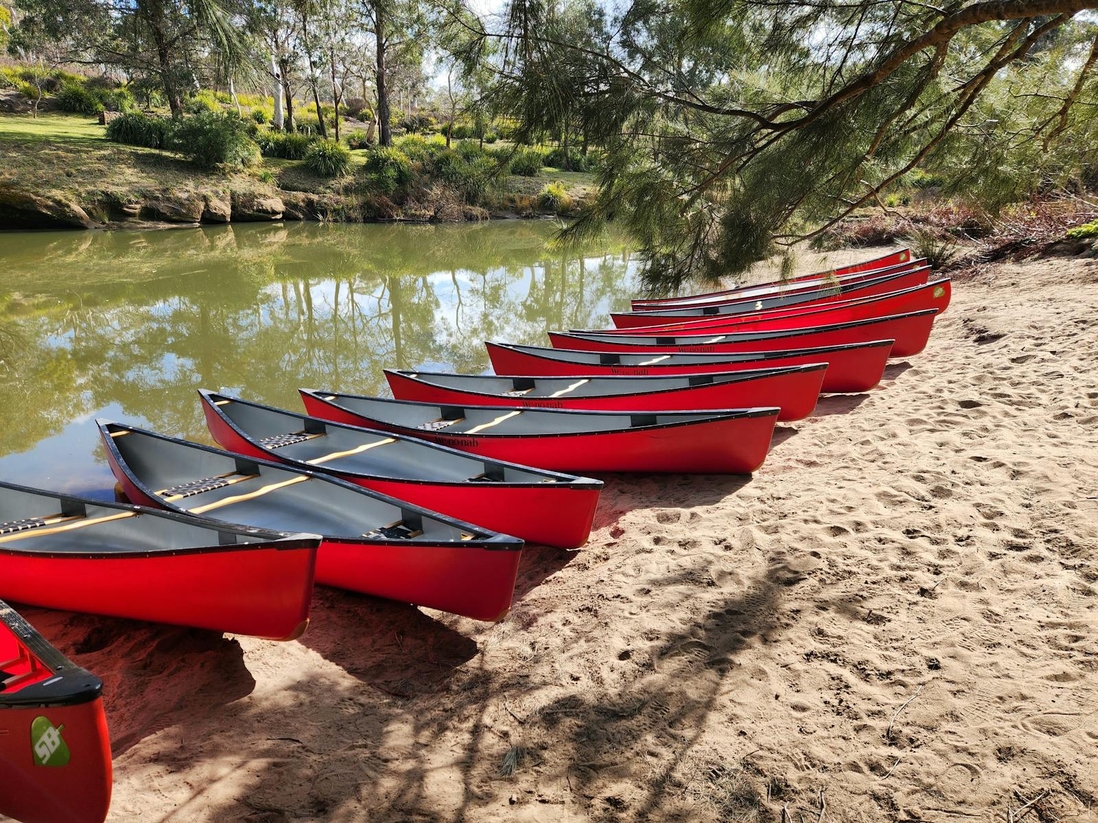 red canoes on the shore
