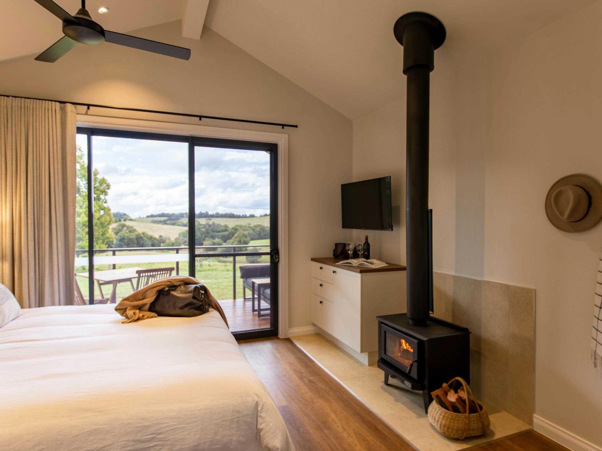 King Farm Cabin interior with fireplace and hinterland views King Farm Cabin interior with fireplace and hinterland views