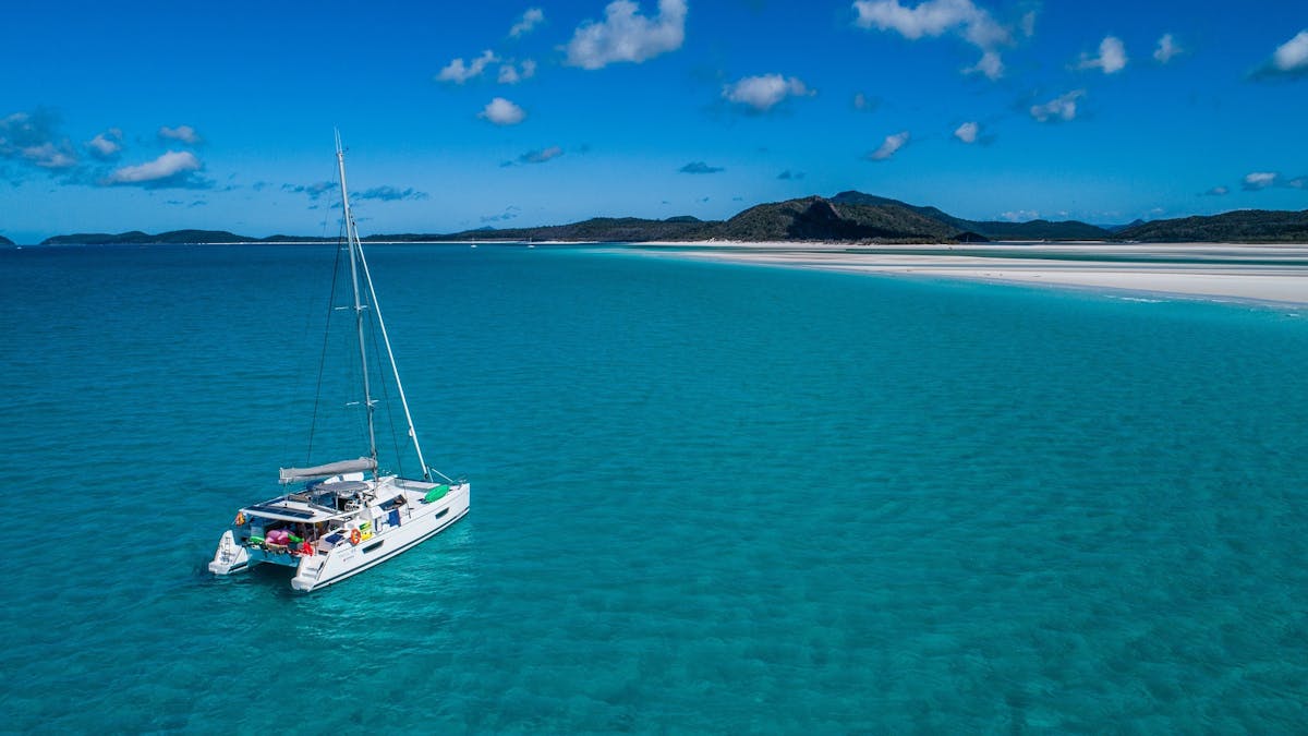 Sailing catamaran at Hill Inlet Sailing catamaran at Hill Inlet