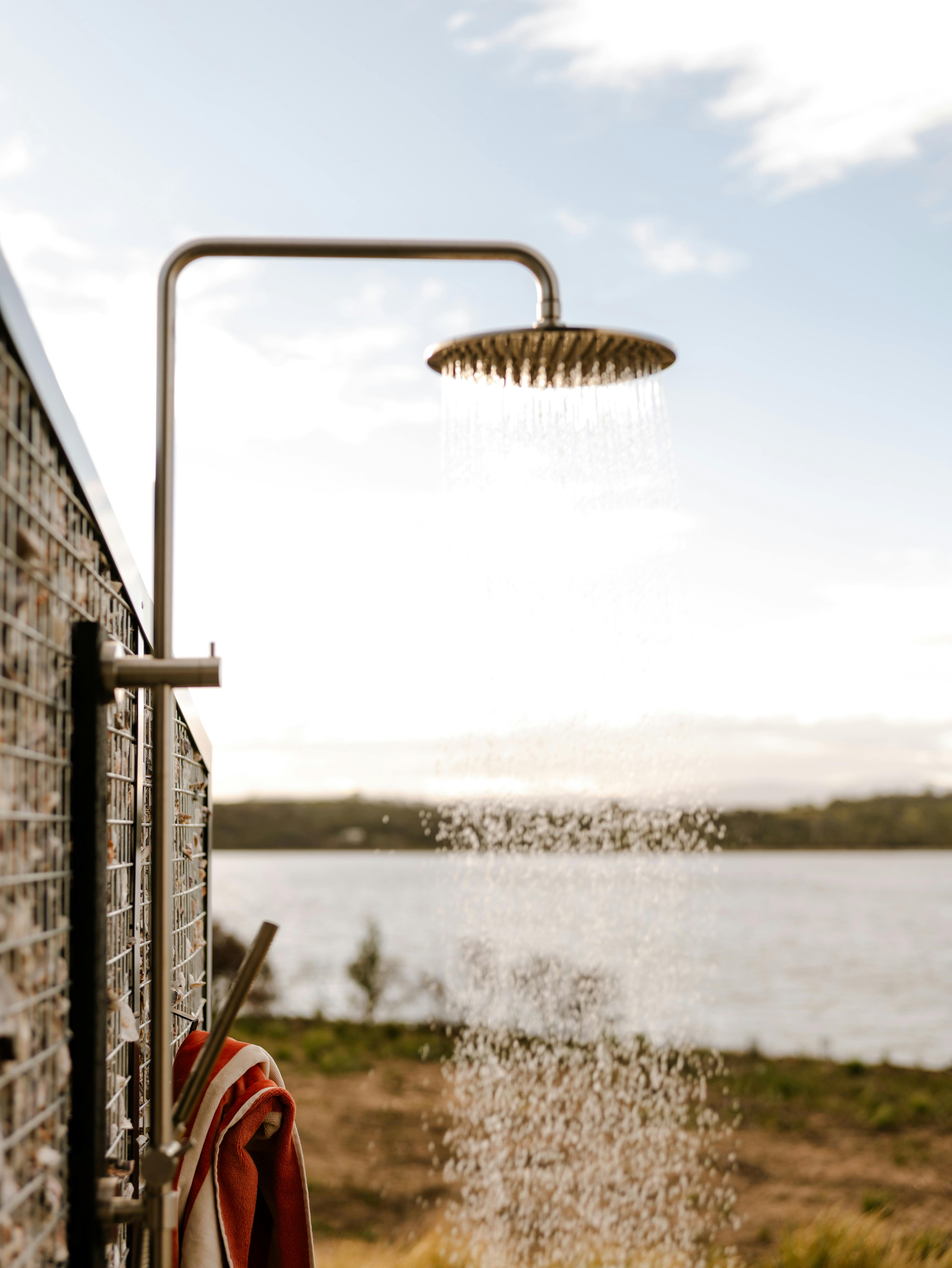 out door showering on the deck is sheltered by oyster shell walls