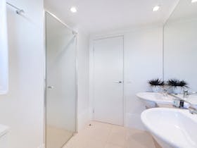 Bathroom - his & hers vanities. Walk-in showers.