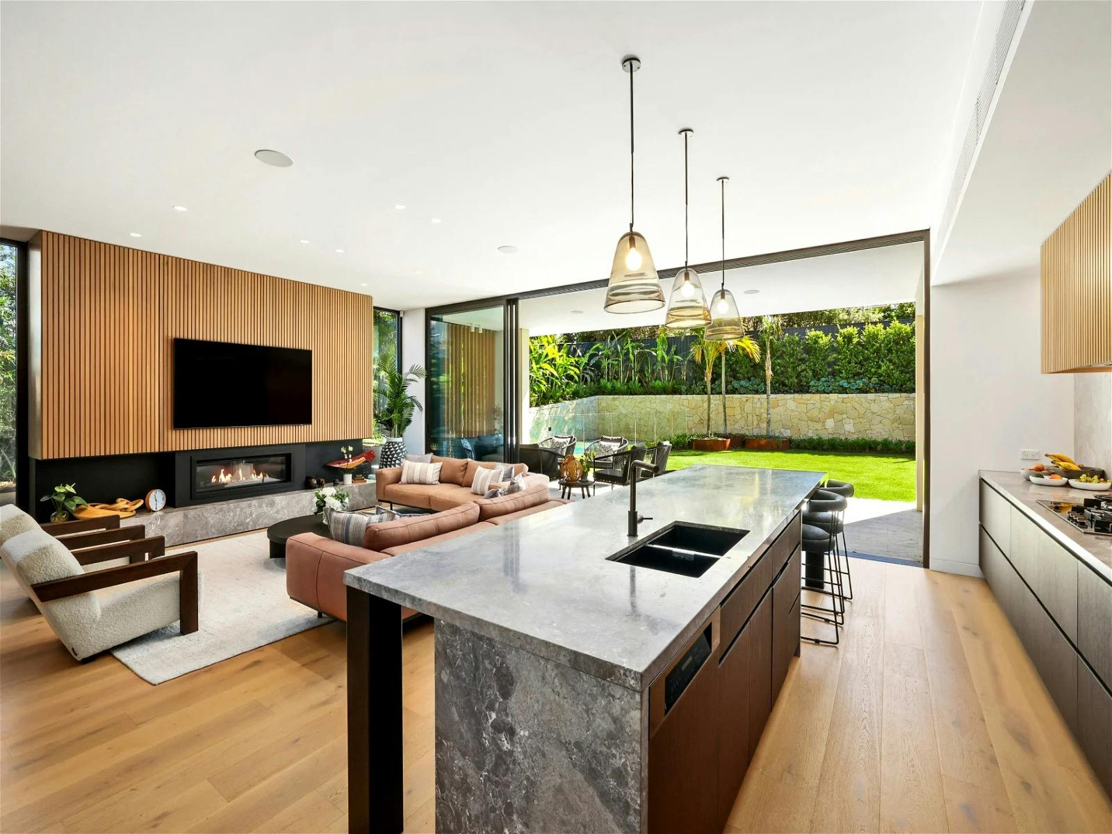 oversized chef’s kitchen with butler’s pantry, adjacent to a gorgeous lounge area