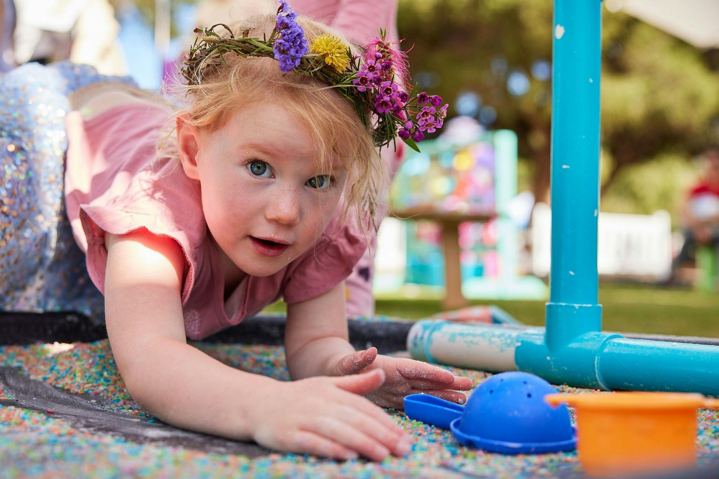 A young girl enjoying sensory play