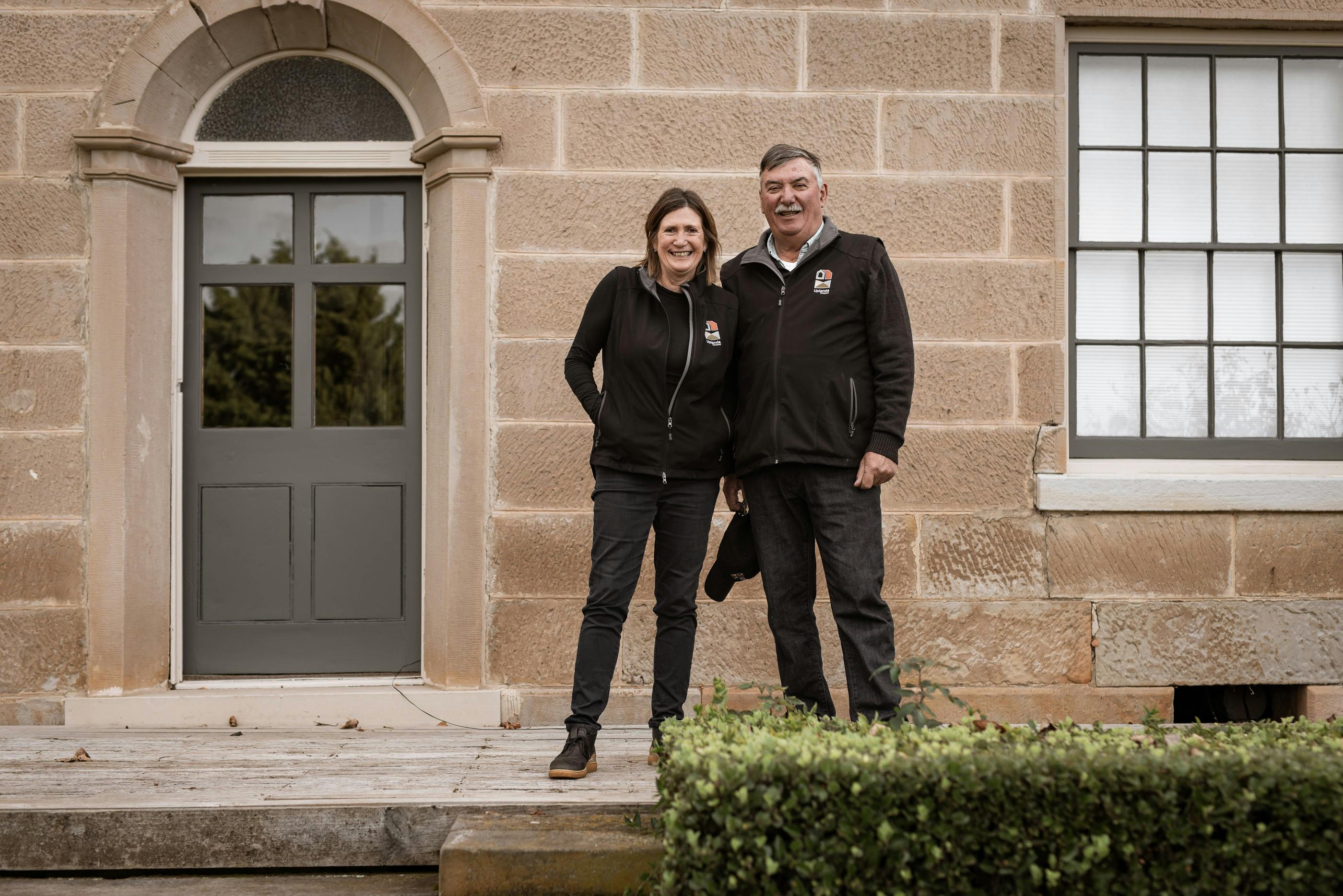 Michael and Deb in front of 1823 house