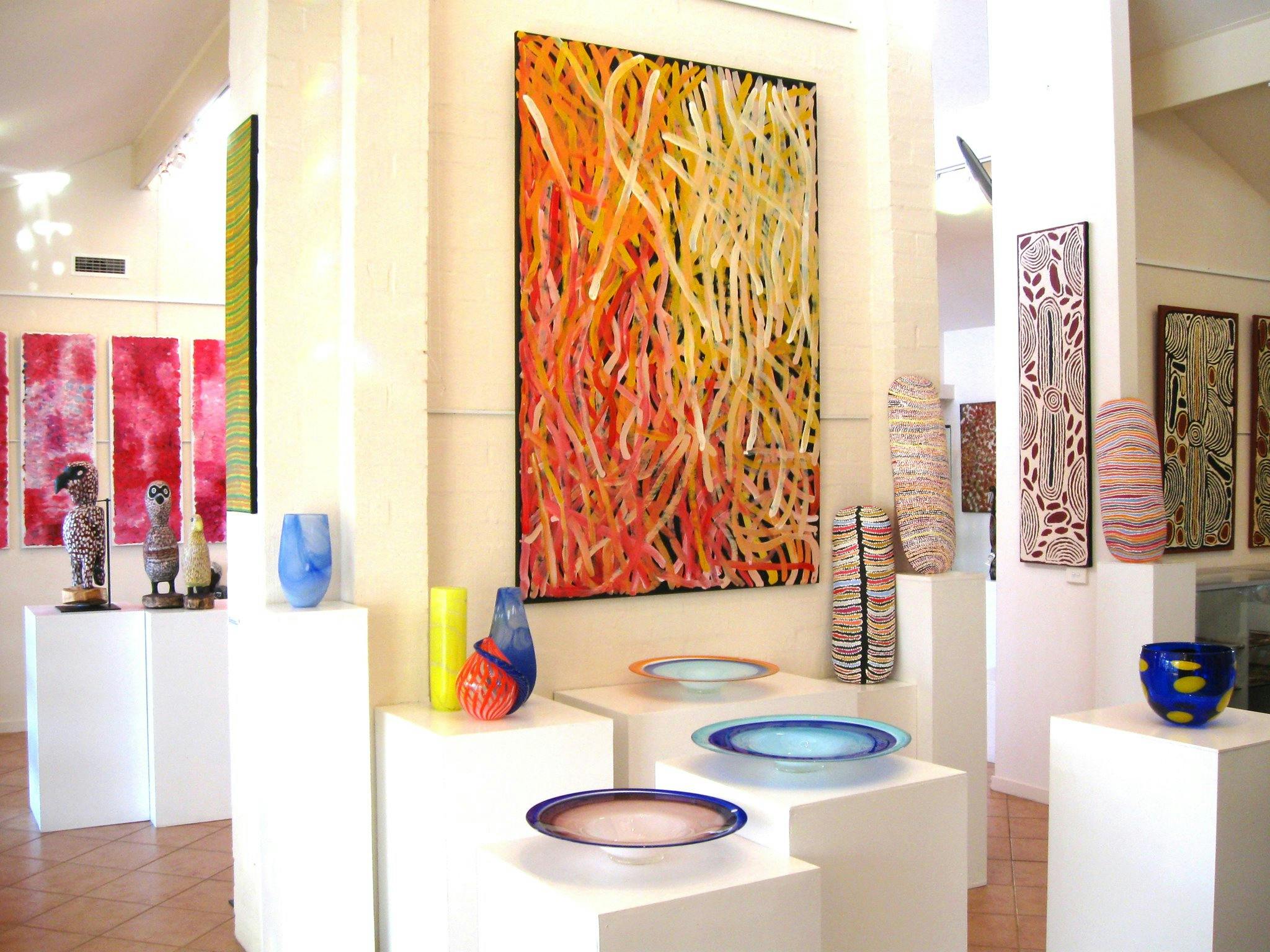 Large, contemporary Aboriginal art paintings. Carved coolamons, carved birds, handcrafted glass.