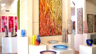 Large, contemporary Aboriginal art paintings. Carved coolamons, carved birds, handcrafted glass.