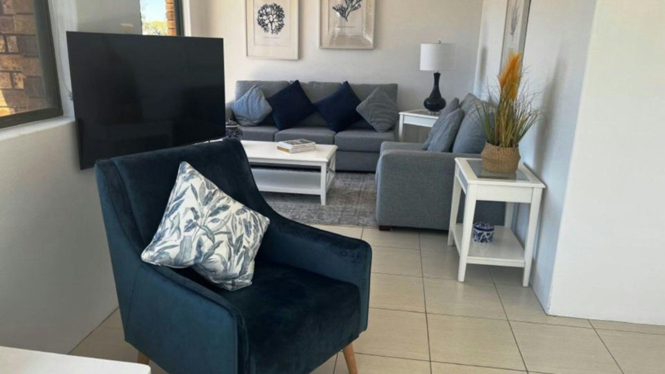 Lounge room with tv and sofas