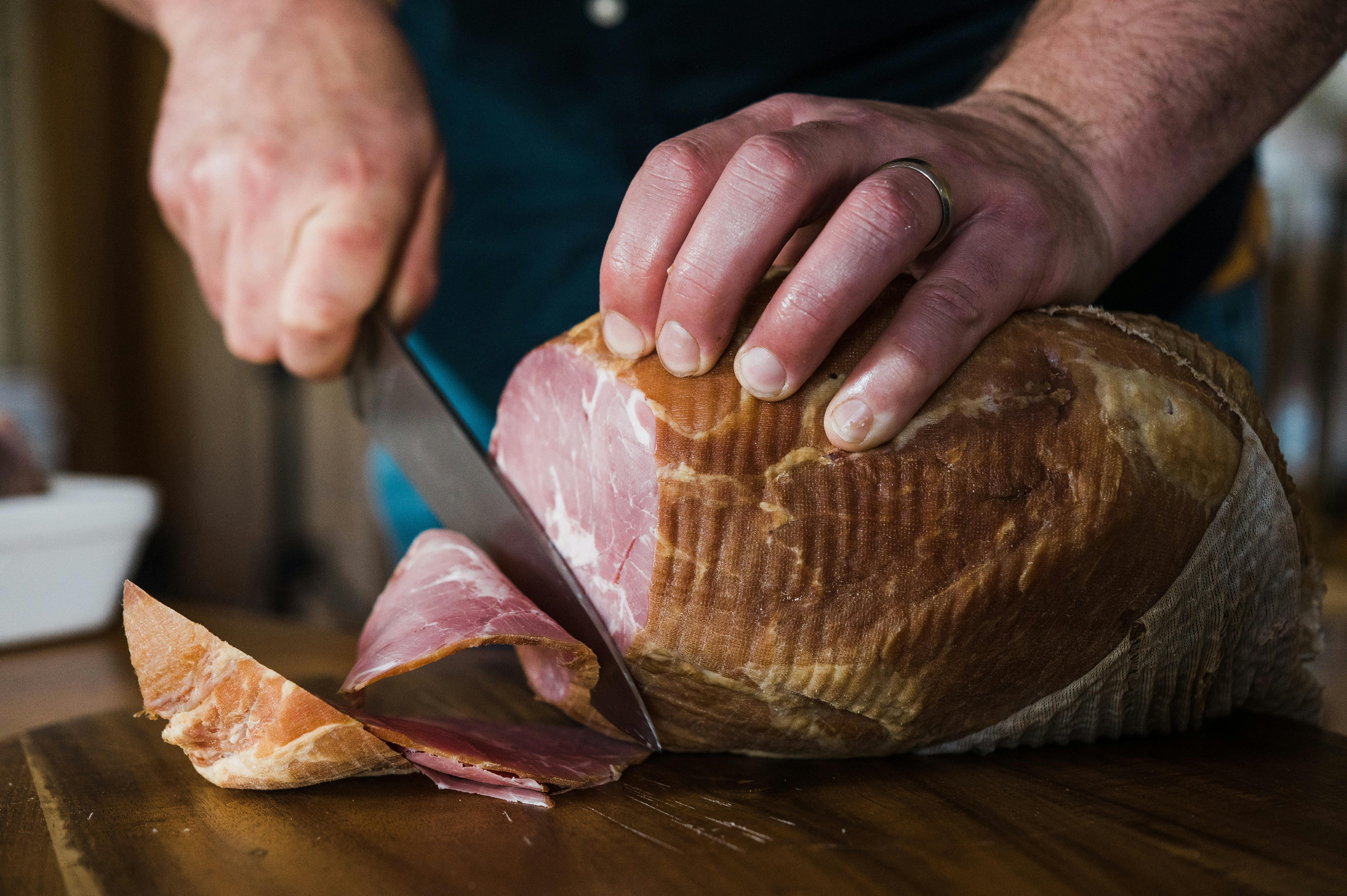 Image shows Casalinga's Boneless Ham being sliced